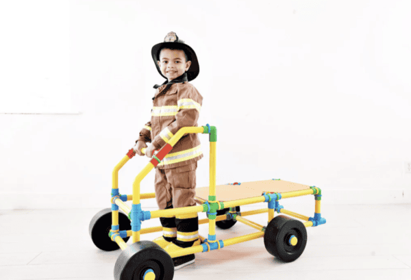 Children building with PetraPlay construction set for creative play.