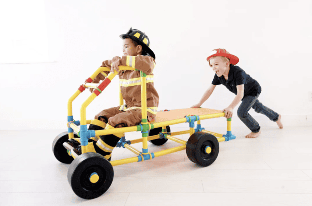 Firefighter and construction kids playing with PetraPlay building set.